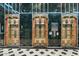 Building entry with three Art Deco elevators at 114 W Adams St # 203, Phoenix, AZ 85003