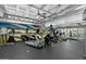 Modern gym with treadmills, ellipticals, and a mural at 114 W Adams St # 203, Phoenix, AZ 85003