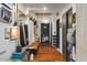 Stylish hallway with hardwood floors and well-organized storage solutions at 114 W Adams St # 203, Phoenix, AZ 85003