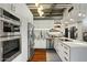 Modern white kitchen with stainless steel appliances at 114 W Adams St # 203, Phoenix, AZ 85003