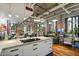 Open concept kitchen with breakfast bar and hardwood floors at 114 W Adams St # 203, Phoenix, AZ 85003