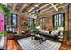 Spacious living area with exposed brick and hardwood floors at 114 W Adams St # 203, Phoenix, AZ 85003