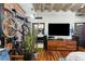 Living room with flat screen TV and hardwood floors at 114 W Adams St # 203, Phoenix, AZ 85003