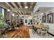 Open concept living area with hardwood floors and exposed brick at 114 W Adams St # 203, Phoenix, AZ 85003