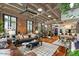 Open living space with exposed brick and hardwood floors at 114 W Adams St # 203, Phoenix, AZ 85003