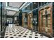 Elegant building lobby with marble walls and a checkered floor at 114 W Adams St # 203, Phoenix, AZ 85003