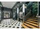 Lobby with grand staircase and rich green marble, offering a luxurious feel at 114 W Adams St # 203, Phoenix, AZ 85003
