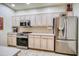 Kitchen with stainless steel appliances and ample cabinetry at 11500 E Cochise Dr # 2019, Scottsdale, AZ 85259