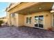 Charming covered patio with spiral staircase and views of the backyard pool area at 11825 S 46Th St, Phoenix, AZ 85044