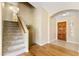 Inviting entryway featuring wood floors and a staircase leading to the upper level at 11825 S 46Th St, Phoenix, AZ 85044
