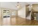 Bright living room with a view of the pool and access to an upstairs living area at 11825 S 46Th St, Phoenix, AZ 85044