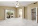 Spacious main bedroom featuring a ceiling fan, and a large sliding glass door leading to the backyard at 11825 S 46Th St, Phoenix, AZ 85044
