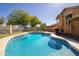 Inviting pool with surrounding landscaping, perfect for outdoor relaxation and entertainment at 11825 S 46Th St, Phoenix, AZ 85044