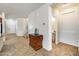 Bright entryway with tile floor, half bath, and storage at 12222 W Planada Ln, Sun City, AZ 85373