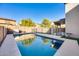 Inviting swimming pool with a large patio, perfect for relaxation and entertaining at 12222 W Planada Ln, Sun City, AZ 85373