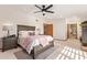 Main bedroom with king-size bed and access to a private balcony at 1321 E Bayview Dr, Tempe, AZ 85283