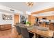 Modern dining room adjacent to kitchen, featuring a wooden table and gray chairs at 1321 E Bayview Dr, Tempe, AZ 85283