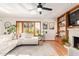 Bright living room with white sectional sofa, fireplace, and built-in shelving at 1321 E Bayview Dr, Tempe, AZ 85283