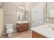 Bathroom with tile floors, double sinks and white cabinets at 13550 W Port Au Prince Ln, Surprise, AZ 85379