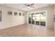 View of the bright living room with tile floors, windows and sliding glass door at 13550 W Port Au Prince Ln, Surprise, AZ 85379