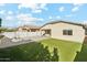 Artificial turf and fire pit highlight this backyard at 1381 W Birch Rd, Queen Creek, AZ 85140