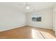 Spacious bedroom with hardwood floors and ceiling fan at 1381 W Birch Rd, Queen Creek, AZ 85140