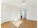 Bright bedroom with hardwood floors and access to bathroom at 1381 W Birch Rd, Queen Creek, AZ 85140
