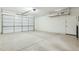 Spacious garage with overhead storage and ample parking space at 1381 W Birch Rd, Queen Creek, AZ 85140