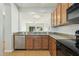 Kitchen with granite countertops and stainless steel dishwasher at 1381 W Birch Rd, Queen Creek, AZ 85140