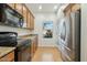 Modern kitchen with stainless steel appliances and wood cabinets at 1381 W Birch Rd, Queen Creek, AZ 85140