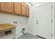 Laundry room with cabinets, built-in shelving, and exterior access at 1381 W Birch Rd, Queen Creek, AZ 85140