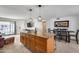 Open kitchen featuring a central island with granite countertops and modern pendant lighting at 1540 W Marco Polo Rd, Phoenix, AZ 85027