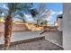 Paver patio in a private backyard featuring a built-in BBQ and desert landscaping at 1612 E Zion Way, Chandler, AZ 85249