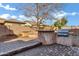 Backyard is a perfect for outdoor dining, featuring a built-in grill and a fire pit at 1612 E Zion Way, Chandler, AZ 85249