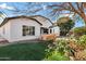 A lush backyard features a built-in grill, artificial turf, and mature landscaping at 1612 E Zion Way, Chandler, AZ 85249