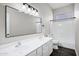 Bright bathroom with double sinks, large mirror, and shower-tub combination with white tile surround at 1612 E Zion Way, Chandler, AZ 85249