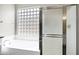 Bathroom includes a soaking tub with glass block window, and a separate shower with glass doors at 1612 E Zion Way, Chandler, AZ 85249