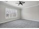 Bright bedroom with neutral carpet, white trim, and plantation shutters that let in plenty of light at 1612 E Zion Way, Chandler, AZ 85249