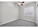 Bedroom with neutral carpet, ceiling fan, and plantation shutters for ample natural light at 1612 E Zion Way, Chandler, AZ 85249