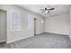 Spacious bedroom with neutral carpet, ceiling fan, and plantation shutters for lots of natural light at 1612 E Zion Way, Chandler, AZ 85249