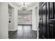 Bright and airy foyer leading into a spacious living area with hardwood floors and modern lighting at 1612 E Zion Way, Chandler, AZ 85249