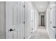 Hallway with tile flooring, white doors, neutral walls, and recessed lighting at 1612 E Zion Way, Chandler, AZ 85249