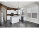 Bright kitchen featuring stone accent wall, stainless steel appliances, and a central island at 1612 E Zion Way, Chandler, AZ 85249