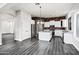 Kitchen featuring stone wall accent, stainless steel appliances, white cabinets and spacious floorplan at 1612 E Zion Way, Chandler, AZ 85249