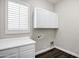 Functional laundry room with modern cabinets, counter space, and ample storage at 1612 E Zion Way, Chandler, AZ 85249