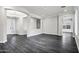 Open-concept living area with dark floors, recessed lighting, and arched openings at 1612 E Zion Way, Chandler, AZ 85249