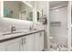 Contemporary bathroom with double sinks and a white hexagonal tile floor at 1720 E Redwood Pl, Chandler, AZ 85286