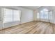 Living room with large window, light walls, and wood floors at 19009 N 25Th Pl, Phoenix, AZ 85050