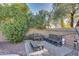 Relaxing patio area with wooden furniture, perfect for outdoor entertaining at 19009 N 25Th Pl, Phoenix, AZ 85050