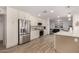 Modern kitchen with stainless steel appliances and white shaker cabinets at 19415 N Conquistador Dr, Sun City West, AZ 85375